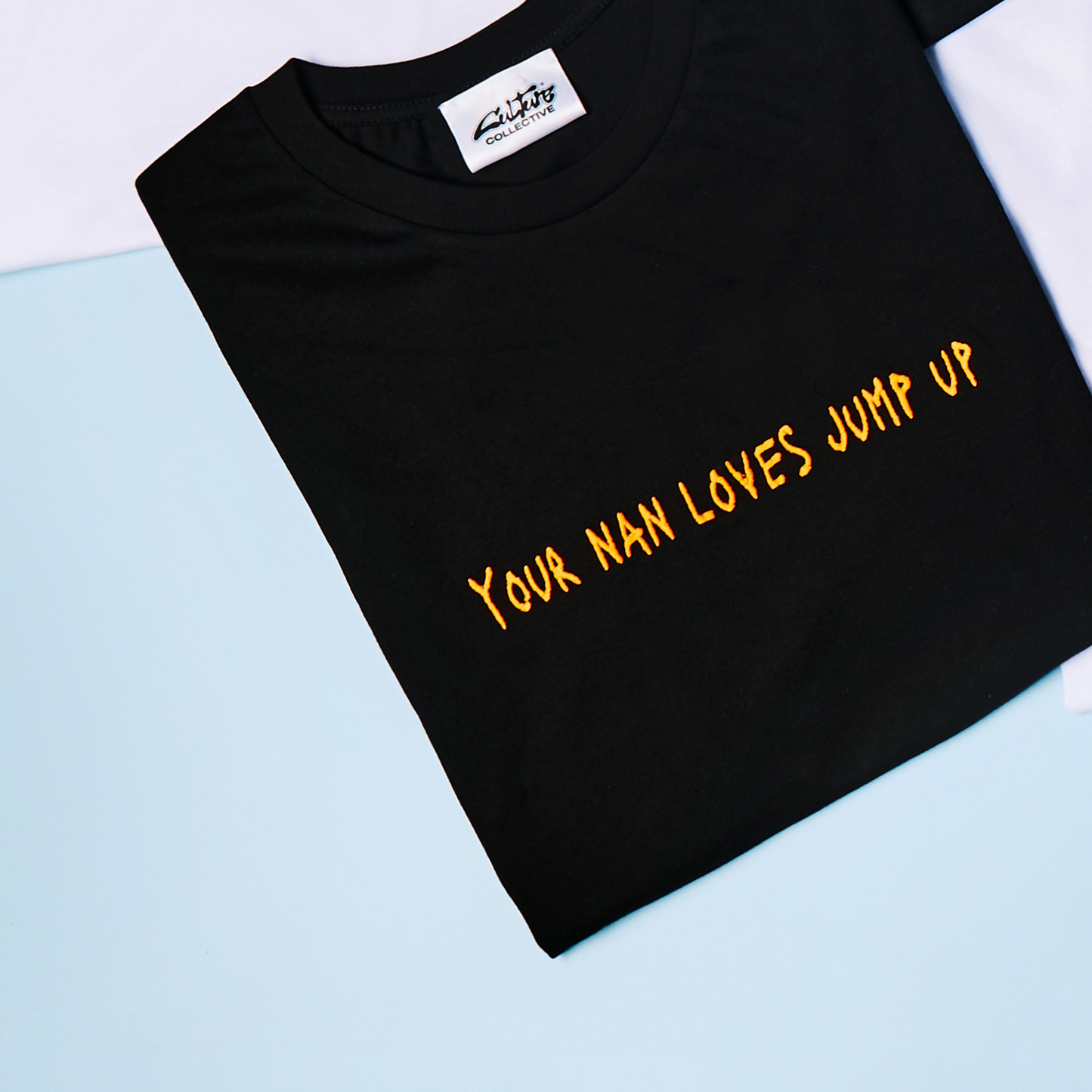 YOUR NAN LOVES JUMP UP TEE BLACK